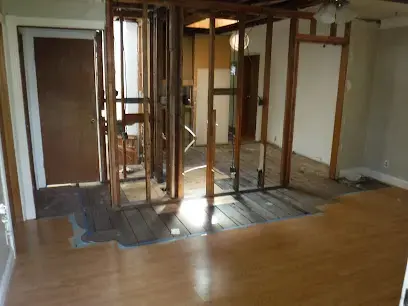 Walls opened to the studs and flooring removed during a water damage dry-out